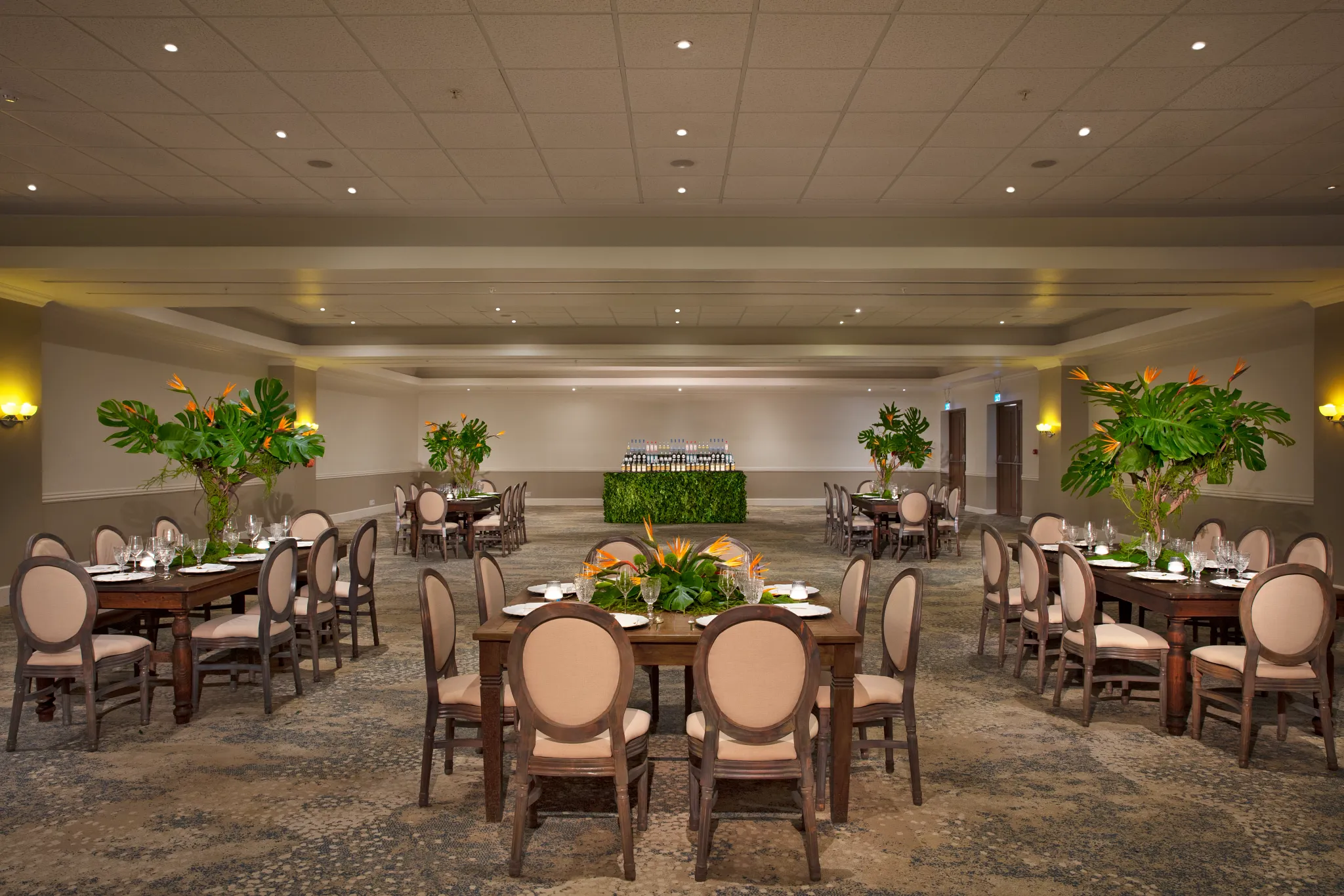 Spacious ballroom with round tables set for an event at Dreams Curaçao Resort.
