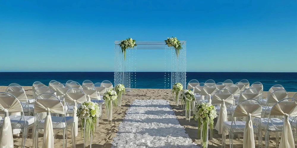 Beach wedding ceremony setup on sandy shores at Dreams Curacao
