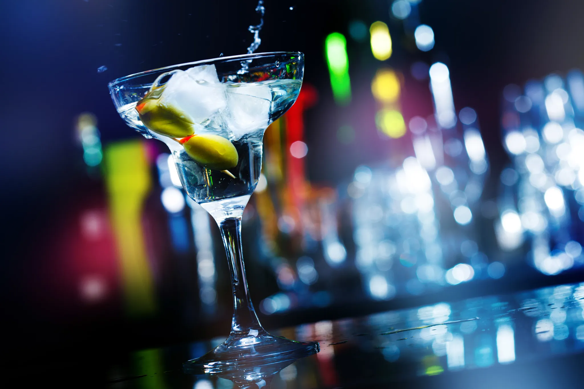 Casino Bar at Dreams Curaçao Resort featuring a stylish gaming lounge bar serving cocktails in the main casino and sportsbook area.