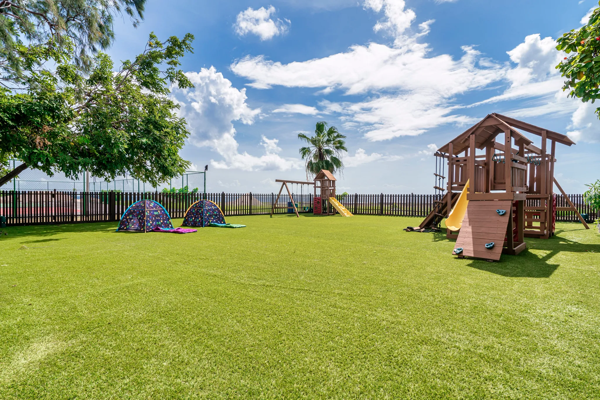 Outdoor kids playground with slides and play structures at Dreams Curaçao Resort, perfect for family-friendly activities.