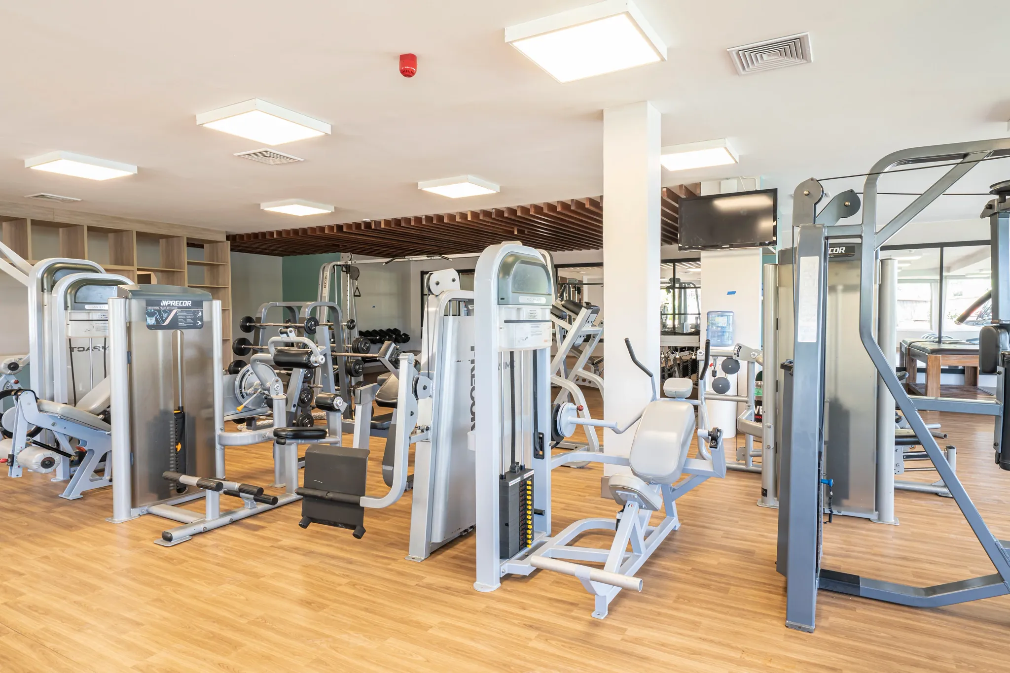 Modern fitness center with strength training equipment at Dreams Curaçao Resort, Spa & Casino.