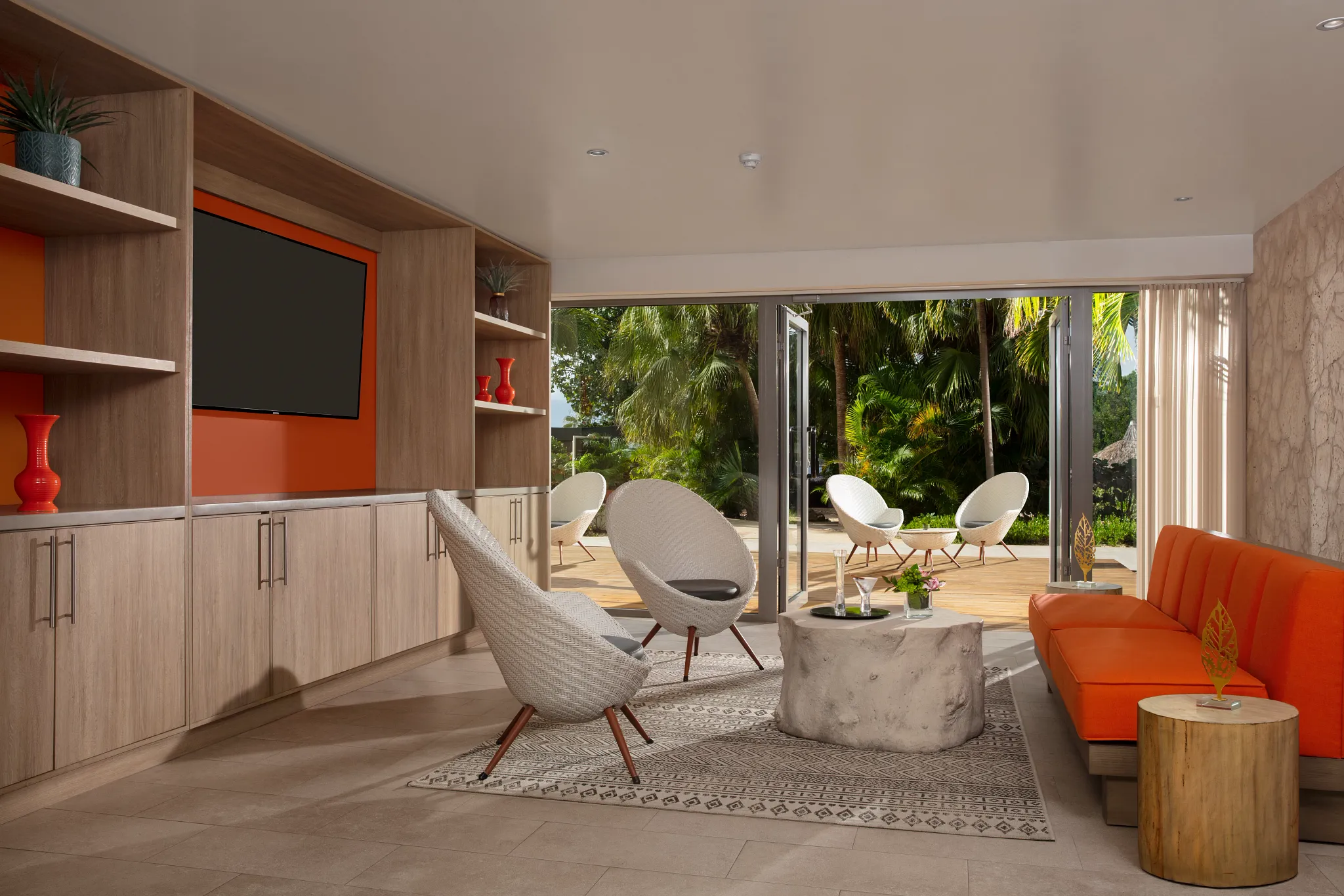 Exclusive Preferred Club lounge with modern seating and garden views at Dreams Curaçao Resort.