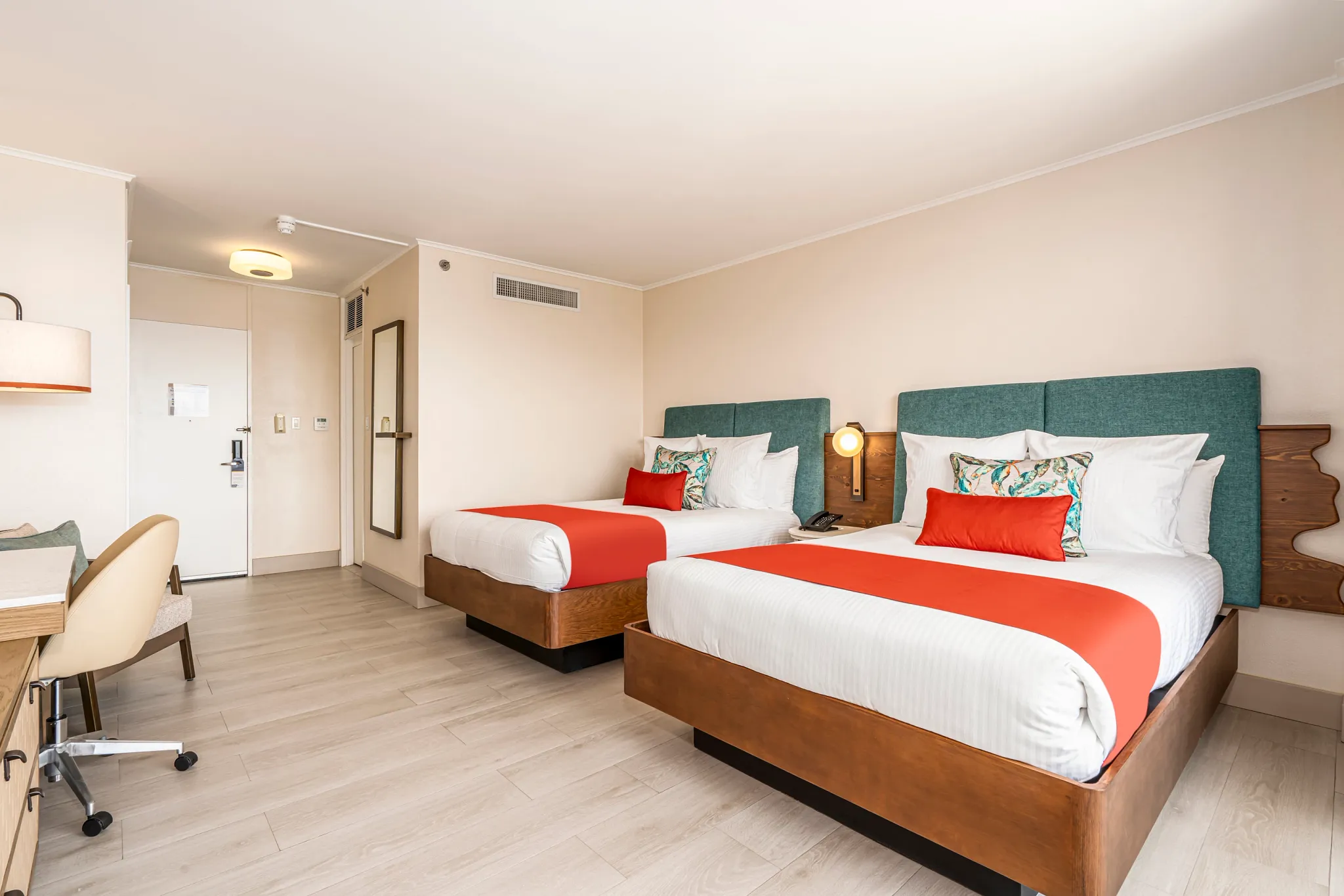 Preferred Club Ocean View room with two double beds at Dreams Curaçao Resort featuring modern design and spacious layout.