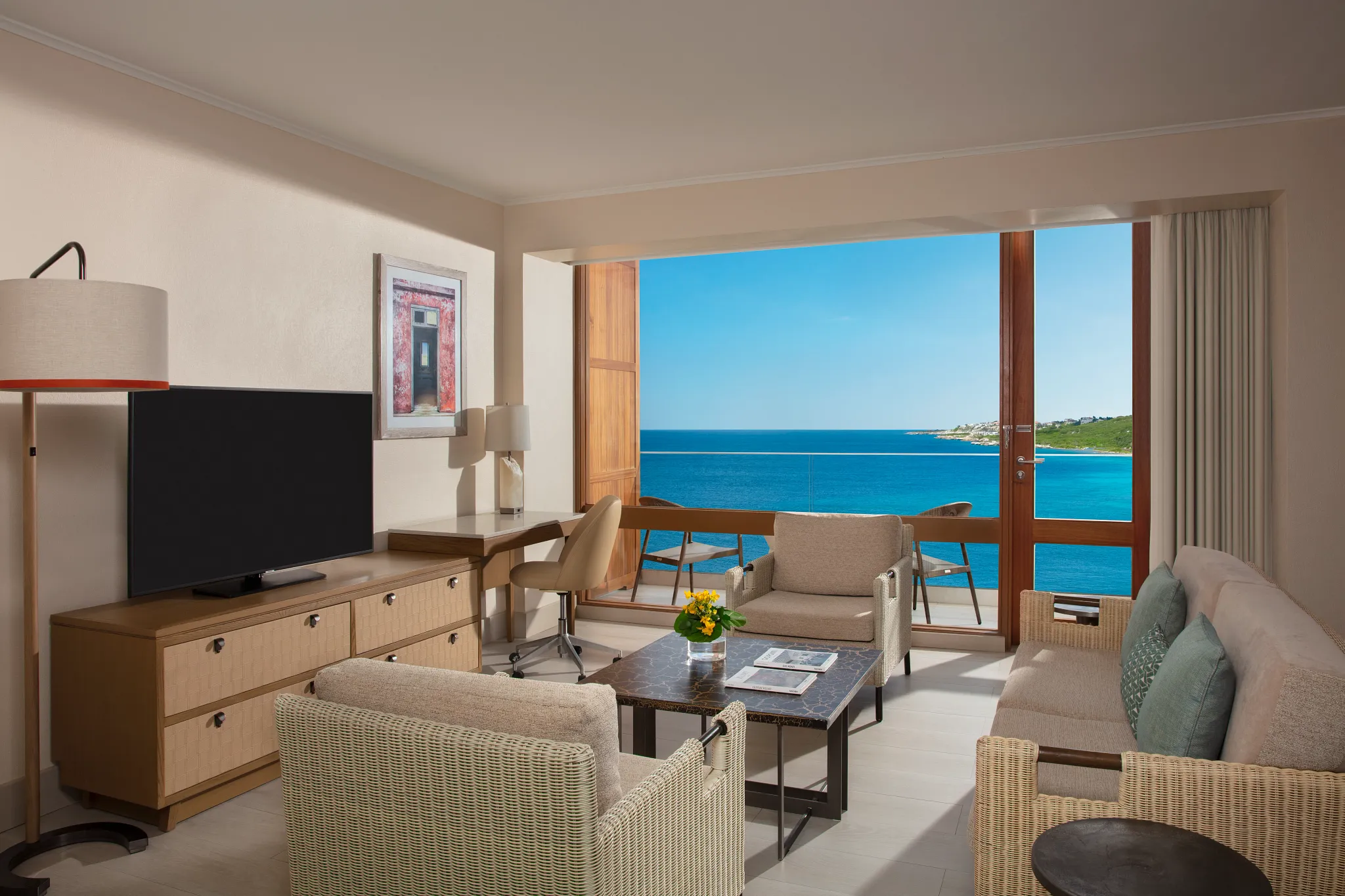 Preferred Club Suite Ocean View living area with balcony and ocean view at Dreams Curaçao Resort.